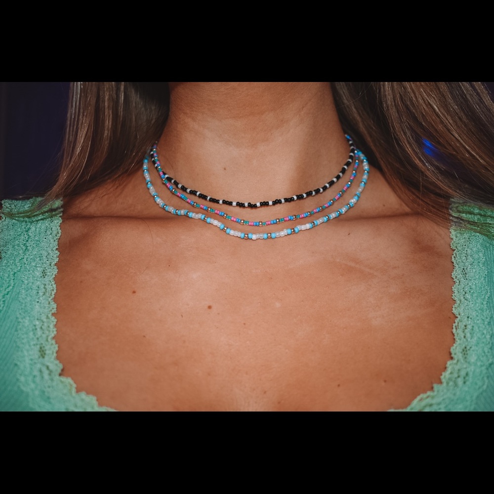 beaded necklaces, anklets or bracelets